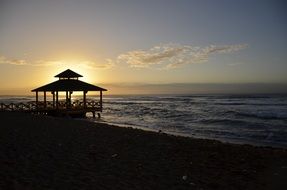 canope on piere in back light, sunset beach, landscape