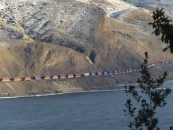 Distant view of a freight train in the mountains of British Columbia