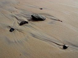 Stones on a sand beach in nature