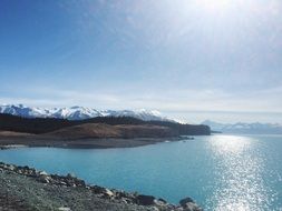 bright sunlight over a mountain lake