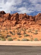 red mountains in the desert along the road