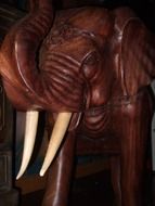 wooden elephant with tusks