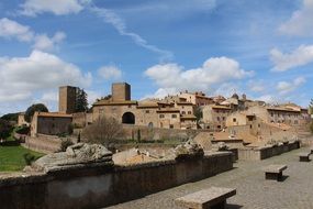 brick buildings on a green hill, italy, Tuscany