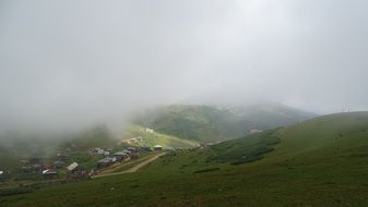 fog over a village in the mountains
