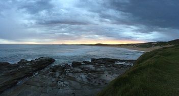 landscape of rocky coastline at the sunset