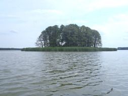 green island on obra lake, poland