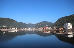 village by the lake near the mountains, namsos, norway