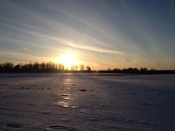 sunset over winter landscapes in sweden