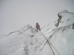 rope descent in snowy mountains