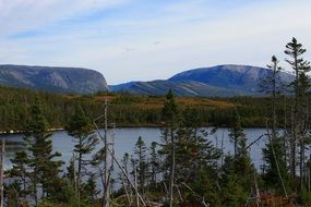 calm water lake near the mountains