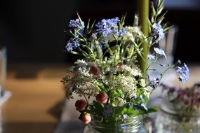 Decorative bouquet of wildflowers close-up on blurred background