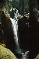 vertical water cascade in gorge