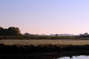 Autumn landscape near the river in the morning