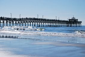 distant view of a pier on the ocean