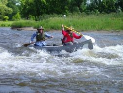 landscape of teamwork rafting in the river