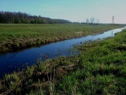cold stream along the field in Poland