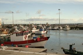 boats and fishing boats at the pier