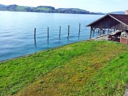 wooden hut on the lake in switzerland