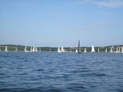 white sailing yachts on the sea