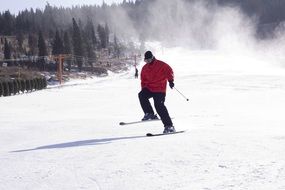 skier in a red jacket on the slope
