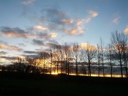 light clouds in the sky at sunset