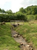 Landscape of wooden bridge over the stream