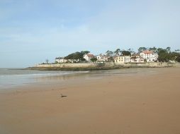 landscape of sand beach at scenic coastal village in france