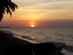 orange sun in the evening on the beach