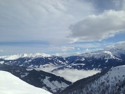 alpine slide under white clouds