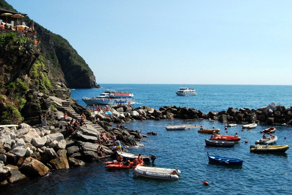 boats on the water near the mountain