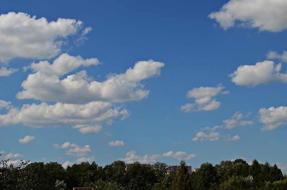 view of white clouds in the blue sky