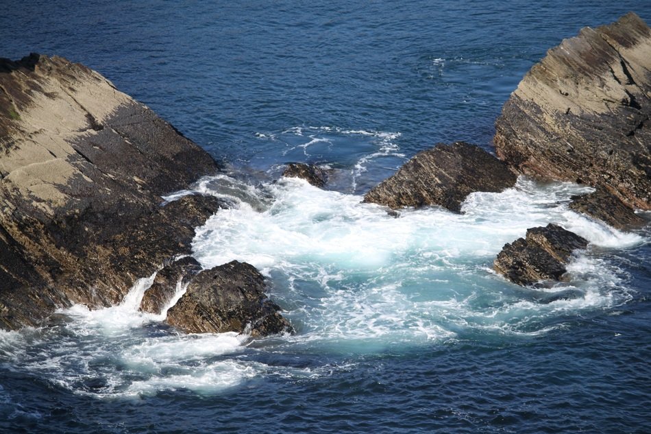 ocean water near the stones