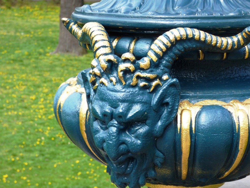 gilded statue with horns in Poland