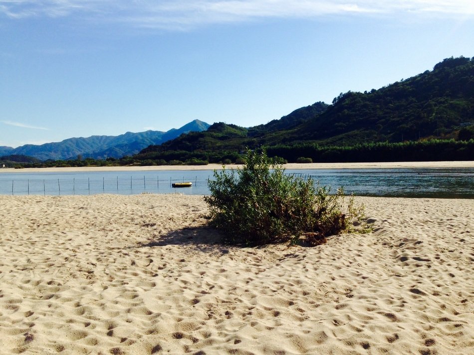 landscape with sand beach and distant mountains, South Korea, seomjin river