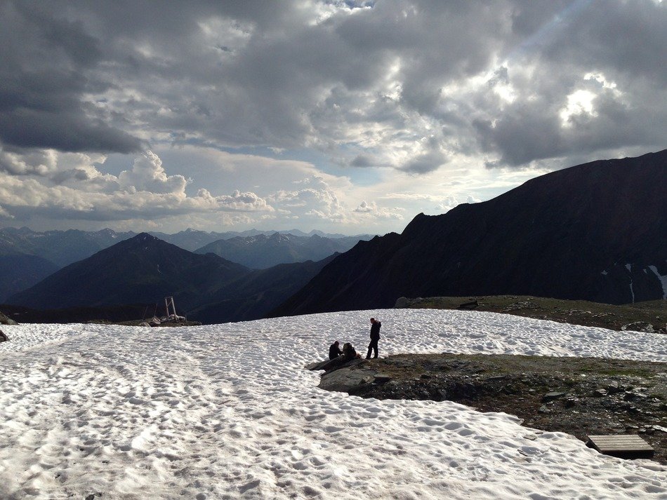 people on the background of a winter landscape of the Alps