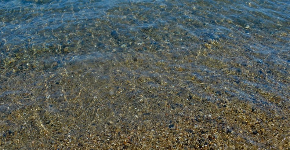 Beautiful clear ocean water with rocks on a tropical island