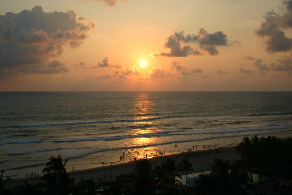 sunset over the beach near the ocean