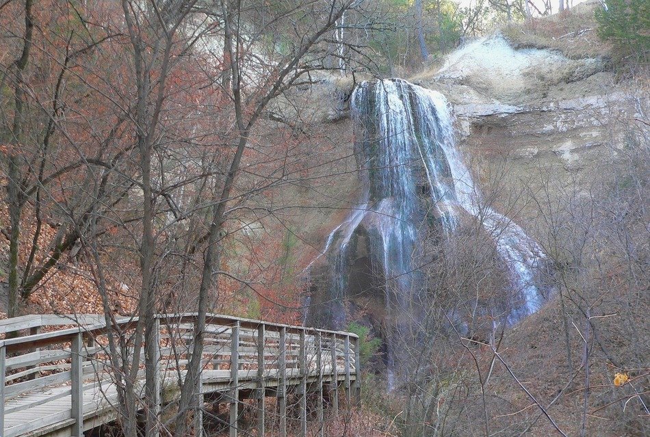 wooden walk path to waterfall on rock in forest, usa, nebraska
