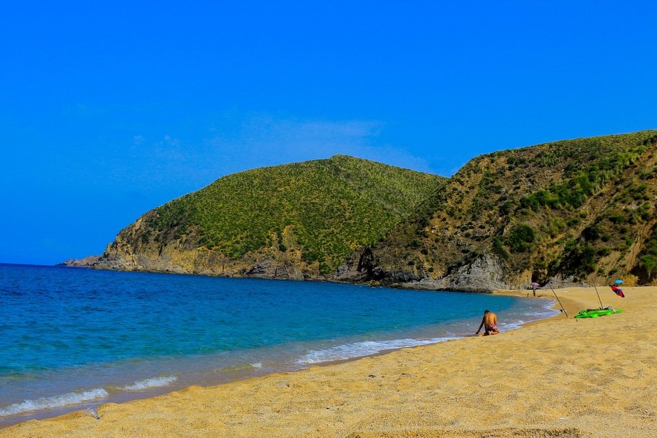 sea and sand beach at mountains, Algeria, skikda