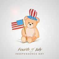 Cute teddy bear holding American national flag