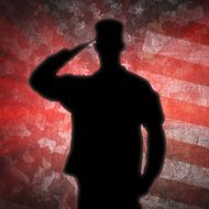 Saluting soldier&#039;s silhouette on an army camouflage background