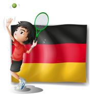boy playing tennis in front of a flag N2