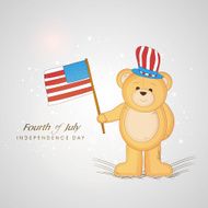 Cute teddy bear holding national flag on shiny grey background