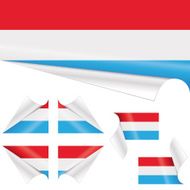 Luxembourgish Flags behind Curled Paper
