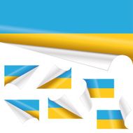 Ukrainian Flags behind Curled Paper
