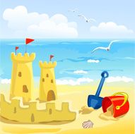 beach with children&#039;s toys and sandcastles