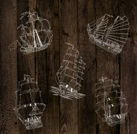 Wooden background with sailing ships