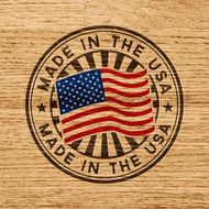 Made in the USA Stamp on wooden background