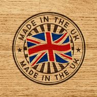 Made in the UK Stamp on wooden background