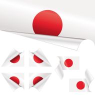 Japanese Flags behind Curled Paper
